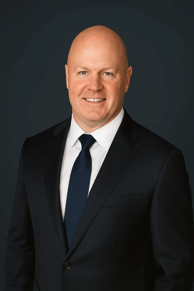 Professional headshot of Mark Van Eden, Principal Attorney at Van Eden Law, wearing a dark suit and tie against a dark background.
